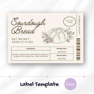 Op de afbeelding: Een beige label voor zuurdesembrood, met de tekst "Sourdough Bread". Het label bevat een broodillustratie, ingrediëntenlijst en een nettogewicht van 500g. Het label bevat ook de tekst "Gluten -Free".