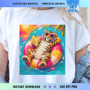 May include: White t-shirt featuring a colorful illustration of a tiger relaxing in a pool float with a drink. The tiger wears sunglasses and is surrounded by water, palm trees, and a bright sun. Text on the shirt reads "LITTLE SKY DIGITAL + ORIGINAL DESIGN" and "INSTANT DOWNLOAD".