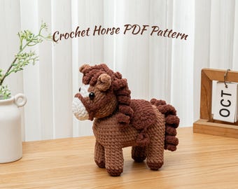 May include: A crocheted horse in shades of brown, with a white muzzle and mane. The text "Crochet Horse PDF Pattern" is displayed above the horse. The horse is on a wooden surface, with a vase of greenery and a wooden calendar in the background.