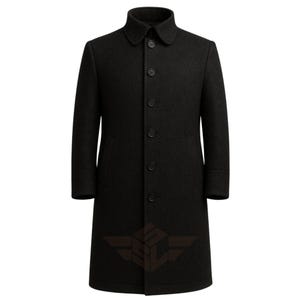 May include: A long, black wool coat with a button-up front and a classic collar. The coat has a tailored fit and long sleeves. The coat is a solid color and is suitable for cold weather.