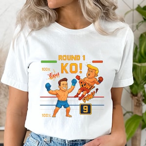 Grappig politiek KO-shirt - ronde 1 knock-out-T-shirt - cartoon bokswedstrijd T-shirt - satire anti-troef grafisch T-shirt - gamerstijl