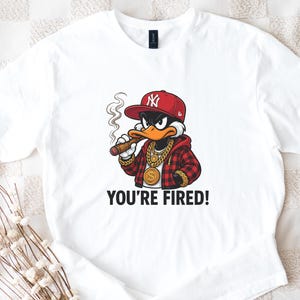 Anti-Trump Funny T-Shirt - “You’re Fired” Duck Graphic Tee - Political Satire Streetwear - Bold Statement Shirt for Protest & Humor