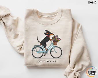 Dackel auf Fahrrad, Apotheker Sweatshirt, Doxycyclin Apotheke Wortspiel Shirt, Apotheker und Techniker Geschenk, Veterinär, Apotheker Geschenke