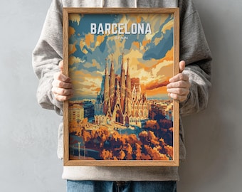 May include: A framed art print featuring the Sagrada Familia in Barcelona, Spain. The artwork uses a warm color palette of oranges, blues, and yellows. The word "BARCELONA" is at the top of the print.