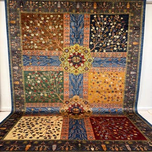 May include: A large, rectangular area rug with a central medallion design and a repeating tree motif. The rug features a variety of colors, including brown, blue, green, and gold. The rug has a fringed edge.