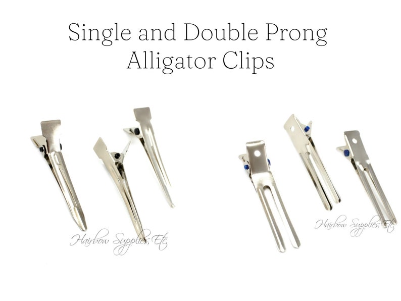 May include: A set of six silver alligator clips, some with single prongs and some with double prongs. The clips are used for holding hair in place.
