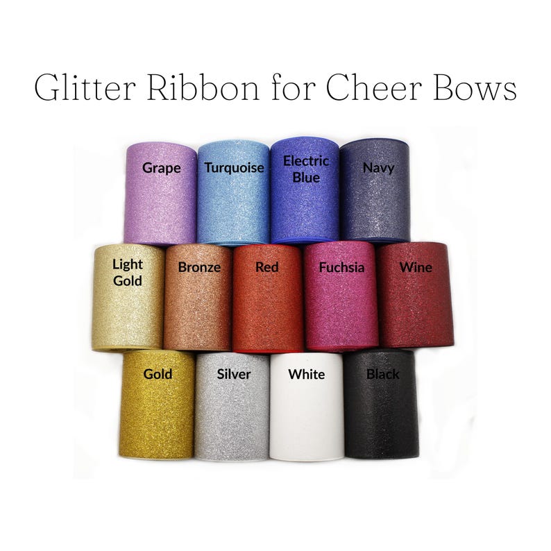 May include: A collection of glitter ribbon rolls in various colors, including grape, turquoise, electric blue, and navy. The image also shows light gold, bronze, red, fuchsia, wine, gold, silver, white, and black rolls. Text reads "Glitter Ribbon for Cheer Bows."