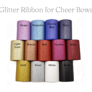 May include: Assortment of glitter ribbon rolls in various colors, including grape, turquoise, electric blue, navy, light gold, bronze, red, fuchsia, wine, gold, silver, white, and black.  Glitter Ribbon for Cheer Bows.