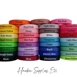 May include: A collection of 36 spools of ribbon in various colors, including yellow gold, lemon yellow, baby maize, apple green, neon green, classical green, jungle green, black, orange, pearl pink, peony, coral rose, hot pink, grape, lavender, heliotrope, wine, pecan, light silver, metal gray, white, turquoise, copen, royal, electric blue, ultramarine, hot pink, passion fruit, fuchsia, red, light blue, aqua, mint, pastel green, and neon yellow. The spools are arranged in three rows of 12 spools each. The text "Hairbow Supplies. Etc." is printed below the spools.
