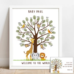 May include: A white framed print with a green tree with brown branches and leaves. The tree has a giraffe, elephant, and lion at the base. The text "BABY PAUL" and "WELCOME TO THE WORLD" are at the top and bottom of the print. A smaller card with a similar tree design is in the bottom right corner with the text "PLEASE 'LEAF' YOUR FINGERPRINT AND SIGN YOUR NAME. THANK YOU!"