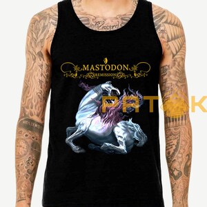 May include: Black tank top featuring the band Mastodon's "Remission" album art. The design includes a rearing white horse with purple and pink mane and tail, and the band's name in gold lettering.