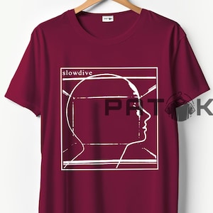 May include: Burgundy t-shirt with a white graphic of a human profile inside a white rectangular frame. The word "slowdive" is above the graphic. The shirt is hanging on a wooden hanger.