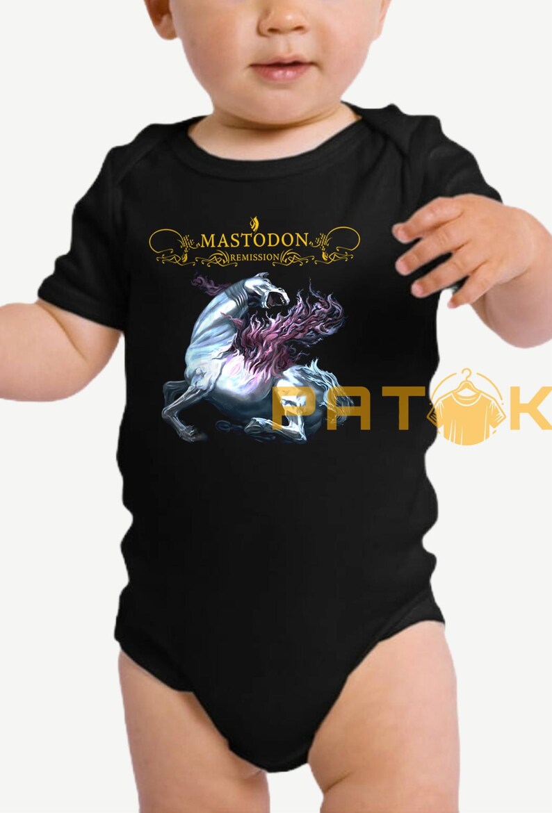 May include: Black baby bodysuit featuring a graphic of a white horse with purple mane and the text "MASTODON REMISSION" in gold. The bodysuit is short-sleeved and has a round neckline.