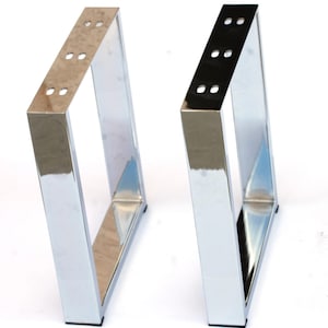 May include: Two shiny, chrome-finished metal table legs. Each leg is a rectangular frame with a triangular profile, featuring pre-drilled holes for easy attachment. The legs are designed for furniture construction and have a reflective surface.