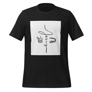 May include: Dark gray t-shirt with a white square graphic. The graphic features the word "Jesus" in a stylized script, along with a crown and a crown of thorns. The shirt is short-sleeved and has a crew neck.