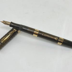 May include: A set of three ceramic mugs with a speckled, matte finish. Each mug features a different color: light blue, cream, and gray. The mugs have a simple, modern design and a comfortable handle.