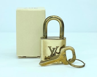 Vintage Louis Vuitton  Brass Lock and matching Key Set, lot number random
