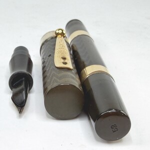 May include: A set of three ceramic mugs with a speckled, matte finish. Each mug features a different color: light blue, cream, and gray. The mugs have a simple, modern design and a comfortable handle.