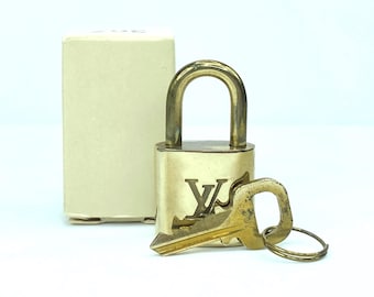 Vintage Louis Vuitton  Brass Lock and matching Key Set, lot number random