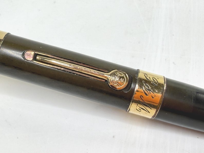 May include: A set of three ceramic mugs with a speckled, matte finish. The mugs are in shades of cream, light gray, and dark gray. Each mug has a simple, minimalist design and a rounded handle.