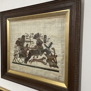 Framed Ancient Egyptian Papyrus Painting of Chariot Hunt – Handcrafted Artwork in Ornate Frame