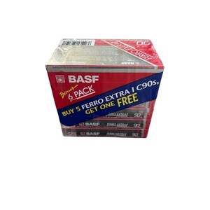 May include: A six-pack of BASF Ferro Extra I C90 audio cassette tapes. The box is red and blue with the BASF logo and text that reads "Buy 5 Ferro Extra I C90s, Get One Free". Each tape is labeled "90".
