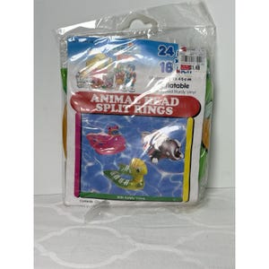 May include: A package of inflatable animal head split rings made of sturdy vinyl. The packaging features the text ANIMAL HEAD SPLIT RINGS and displays illustrations of a pink, a grey, and a green inflatable ring. The package measures 24 inches by 18 inches.