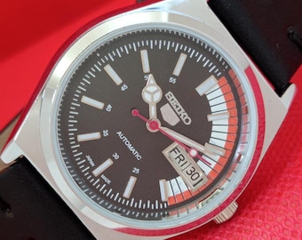 Vintage Seiko 5 Automatic Watch: Refurbished Black Dial, Transparent Back