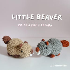 May include: Two crocheted beaver plushies, one tan and one gray, with brown tails and accents. The tan beaver has white teeth. The image includes the text "LITTLE BEAVER" and "NO-SEW PDF PATTERN". The plushies are handmade.