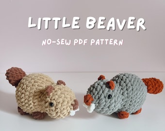 May include: Two crocheted beaver plushies, one tan and one gray, with brown tails and accents. The tan beaver has white teeth. The image includes the text "LITTLE BEAVER" and "NO-SEW PDF PATTERN". The plushies are handmade.