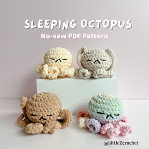May include: Four crocheted octopus toys in various colors: cream, gray, tan, and a pastel mix. Each octopus has closed eyes, suggesting sleep. The text "SLEEPING OCTOPUS" and "No-sew PDF Pattern" are displayed above the toys.