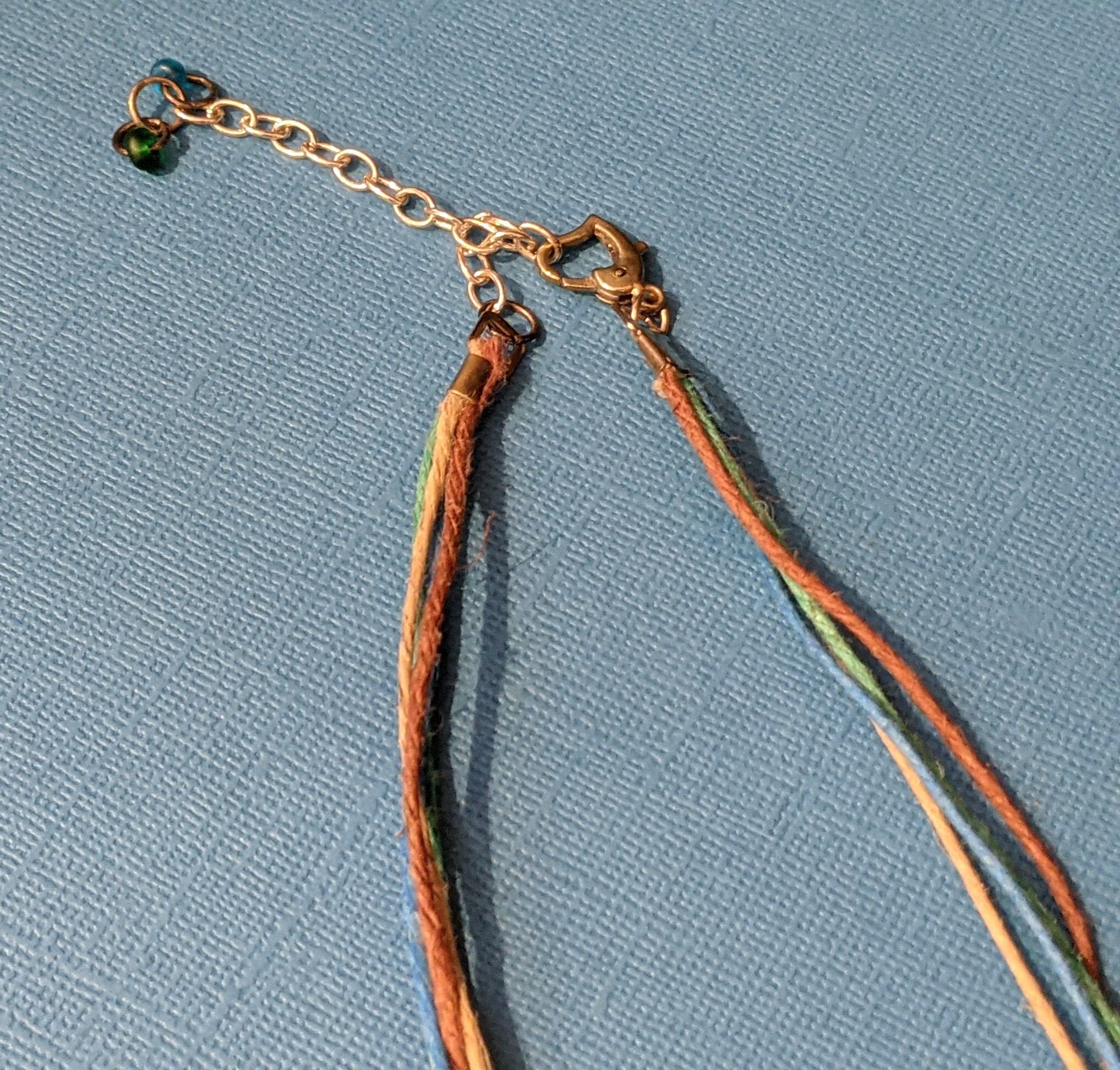 Necklace mix, bone / leather / wood / hemp (dyed), mixed colors, 5-inch  dangle with mixed shape pendant and accent beads, 28 inches hemp cord with  bone and cord button-style clasp. Sold