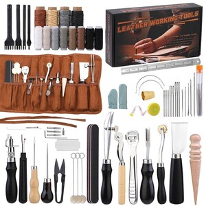May include: A comprehensive leather working tool kit. Includes a variety of tools such as needles, thread, cutting tools, and a brown leather tool roll. Also includes spools of thread in various colors and a box labeled "Leather Working Tools."