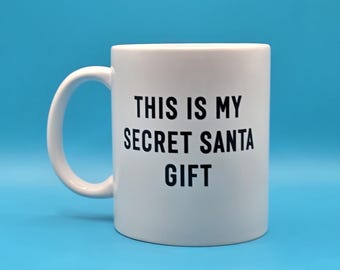 Funny Secret Santa Mug – “This Is My Secret Santa Gift” – Christmas Coffee Cup, Office Party Gift Exchange, Stocking Filler Under 10 pounds!