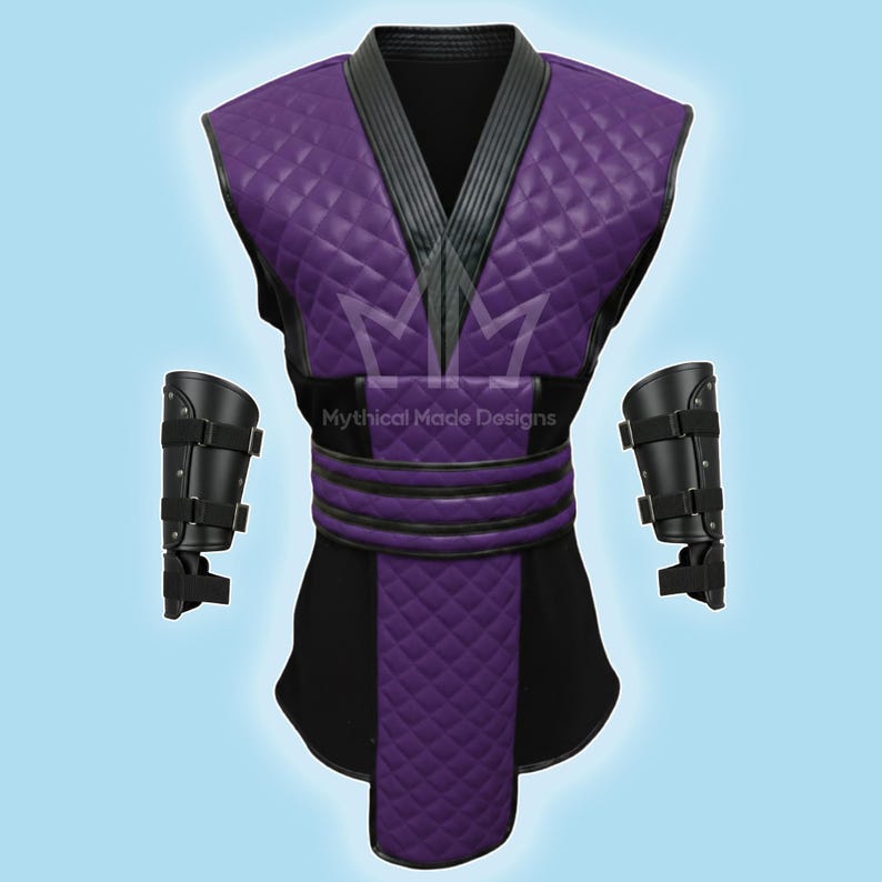 May include: A purple and black costume with diamond-patterned accents. The costume includes a vest, belt, and two arm guards. The vest has a quilted design and a black collar. The text "Mythical Made Designs" is visible.