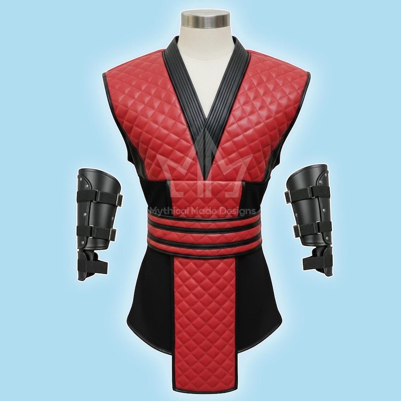May include: A red and black quilted costume with a V-neck design. The costume includes a vest, a skirt, and two black arm guards. The text "Mythical Made Designs" is visible on the costume.