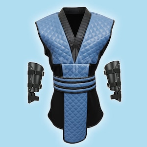 May include: A blue and black costume with a quilted pattern, featuring a V-neck top, a black belt, and matching arm guards. The costume has a diamond pattern on the chest and lower section. The text "Mythical Made Designs" is visible.