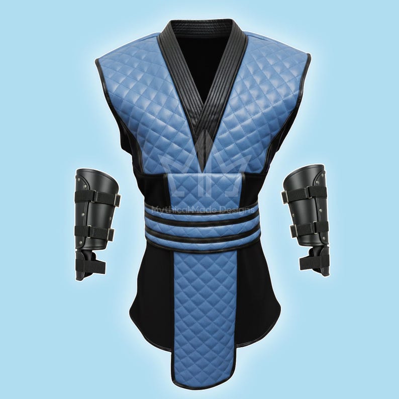 May include: A blue and black costume with a quilted pattern, featuring a V-neck top, a black belt, and matching arm guards. The costume has a diamond pattern on the chest and lower section. The text "Mythical Made Designs" is visible.