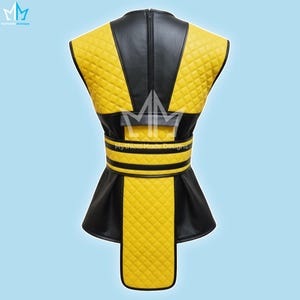 May include: A yellow and black vest with a quilted pattern. The vest has a black collar and a zipper down the back. The waist features a black belt with yellow stripes. The text "Mythical Made Designs" is visible.