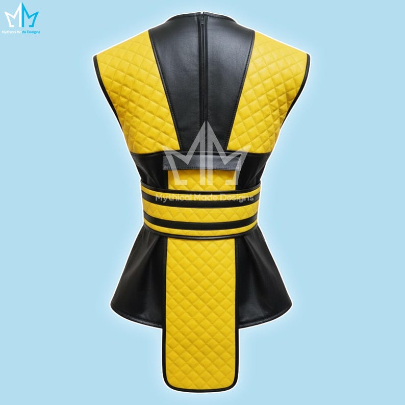 May include: A yellow and black vest with a quilted pattern. The vest has a black collar and a zipper down the back. The waist features a black belt with yellow stripes. The text "Mythical Made Designs" is visible.
