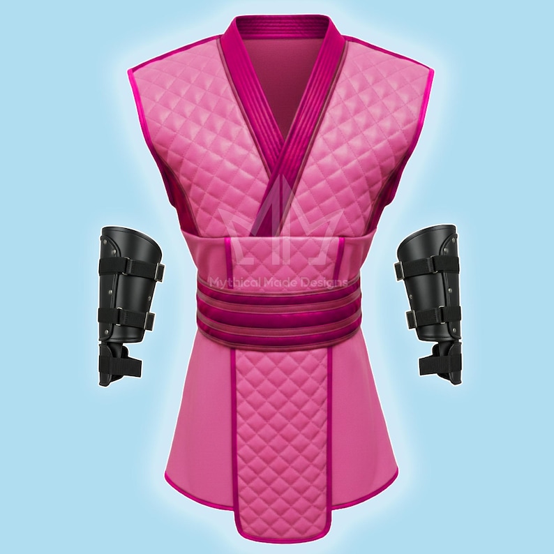 May include: A pink quilted costume with a matching belt and two black arm guards. The costume has a V-neck design and a flared skirt. The text "Mythical Made Designs" is visible on the costume.