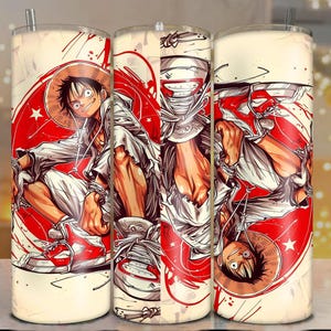 May include: A set of three stainless steel tumblers featuring a vibrant anime-style illustration. The design showcases a character in a straw hat, white outfit, and red sneakers, set against a red and white background. Each tumbler has a straw.