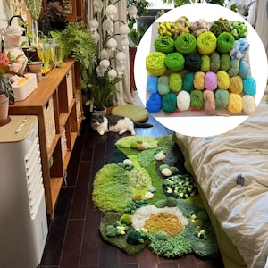 May include: A handmade, green and yellow rug with a floral design, featuring various textures and shades of green. A collection of yarn balls in shades of green, yellow, and blue is in the upper right corner. A cat is lying on the floor near the rug.