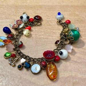 Vintage metal, glass and early plastic charms "forget me not" bracelet - Cracker Jack Gumball Prizes toys