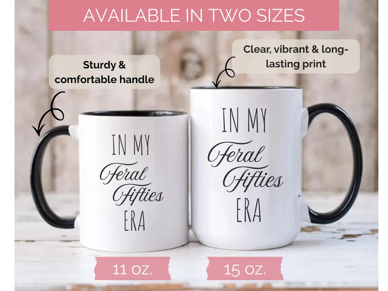 May include: Two white ceramic mugs with black handles and rims. The mugs have the text "IN MY Feral Fifties ERA" in black script. One mug is 11 oz, the other is 15 oz. The mugs are labeled as having a sturdy and comfortable handle and a clear, vibrant, and long-lasting print.