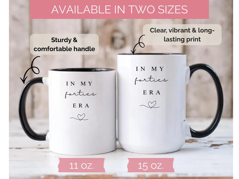 May include: Two white ceramic mugs with black handles and rims. The mugs have the text "IN MY forties ERA" and a heart symbol. One mug is 11 oz, the other is 15 oz. The image text says "Available in two sizes".