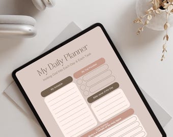 May include: A digital planner with the text "My Daily Planner" and "Inviting God Into Each Day & Each Task." The planner includes sections for schedule, top priorities, Bible verse, and daily nutrition. A pair of white headphones and a vase of dried flowers are also visible.