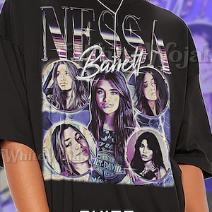 May include: Black unisex t-shirt featuring a graphic of Nessa Barrett's name in a chrome-like font, with multiple images of her face. The shirt also has the text "SHIRT Unisex".
