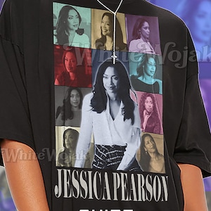May include: Black unisex t-shirt featuring a collage of images of Jessica Pearson. The shirt has the text "JESSICA PEARSON" in large white letters, with "SHIRT Unisex" below. The shirt is oversized.