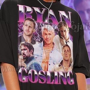 May include: Black unisex t-shirt featuring a graphic of Ryan Gosling with the text "RYAN GOSLING" in a purple and white design. The shirt also has the text "SHIRT Unisex".